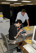 L-Net and DRAGON reps checking the Movaz RAYexpress unit prior to its rack mounting at GSFC